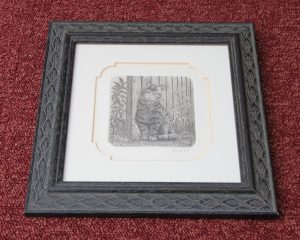 Mounted and framed etching. Yellowing of the bevel is showing signs of the mount becoming acidic.
