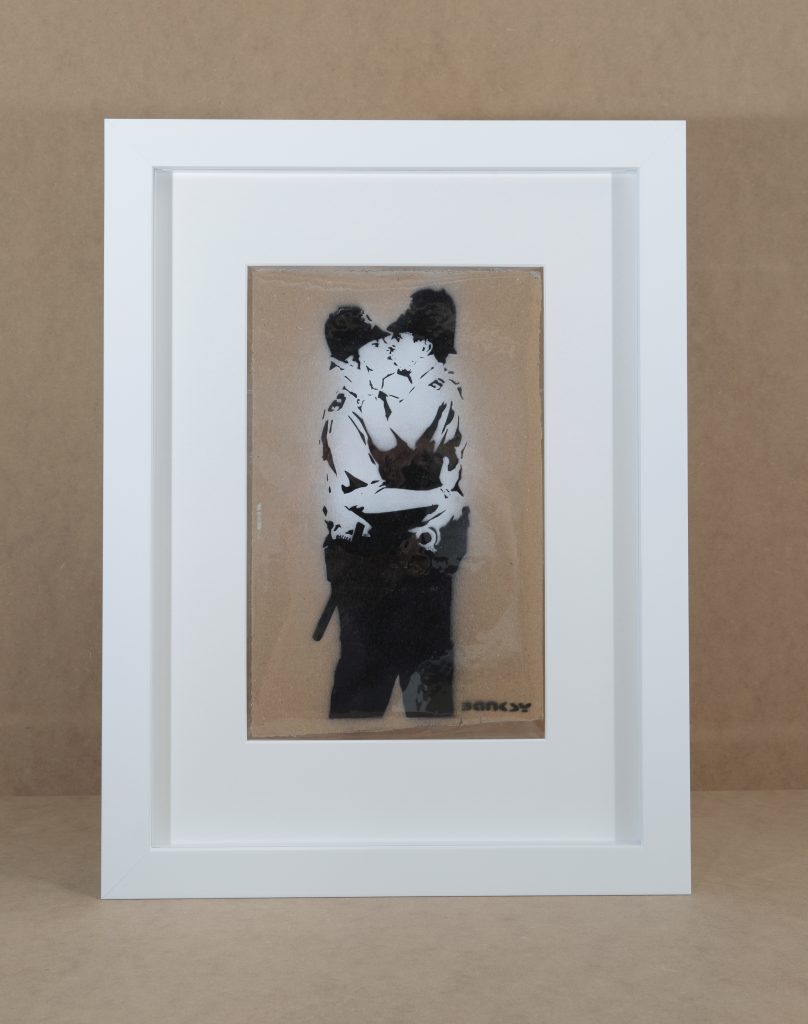 Banksy's Kissing Coppers an example of valuable art to be bespoke framed